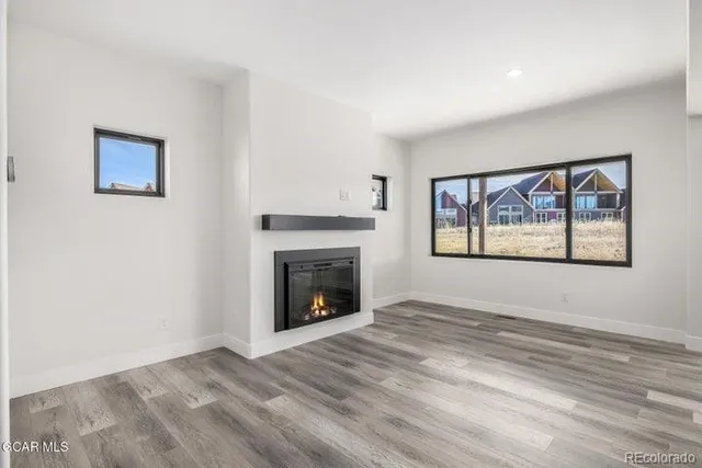 a kitchen with stainless steel appliances kitchen island wooden cabinets and granite counter tops