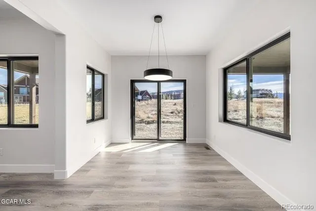 a view of a kitchen with a large window