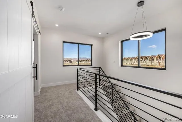 a view of a balcony with a floor to ceiling window