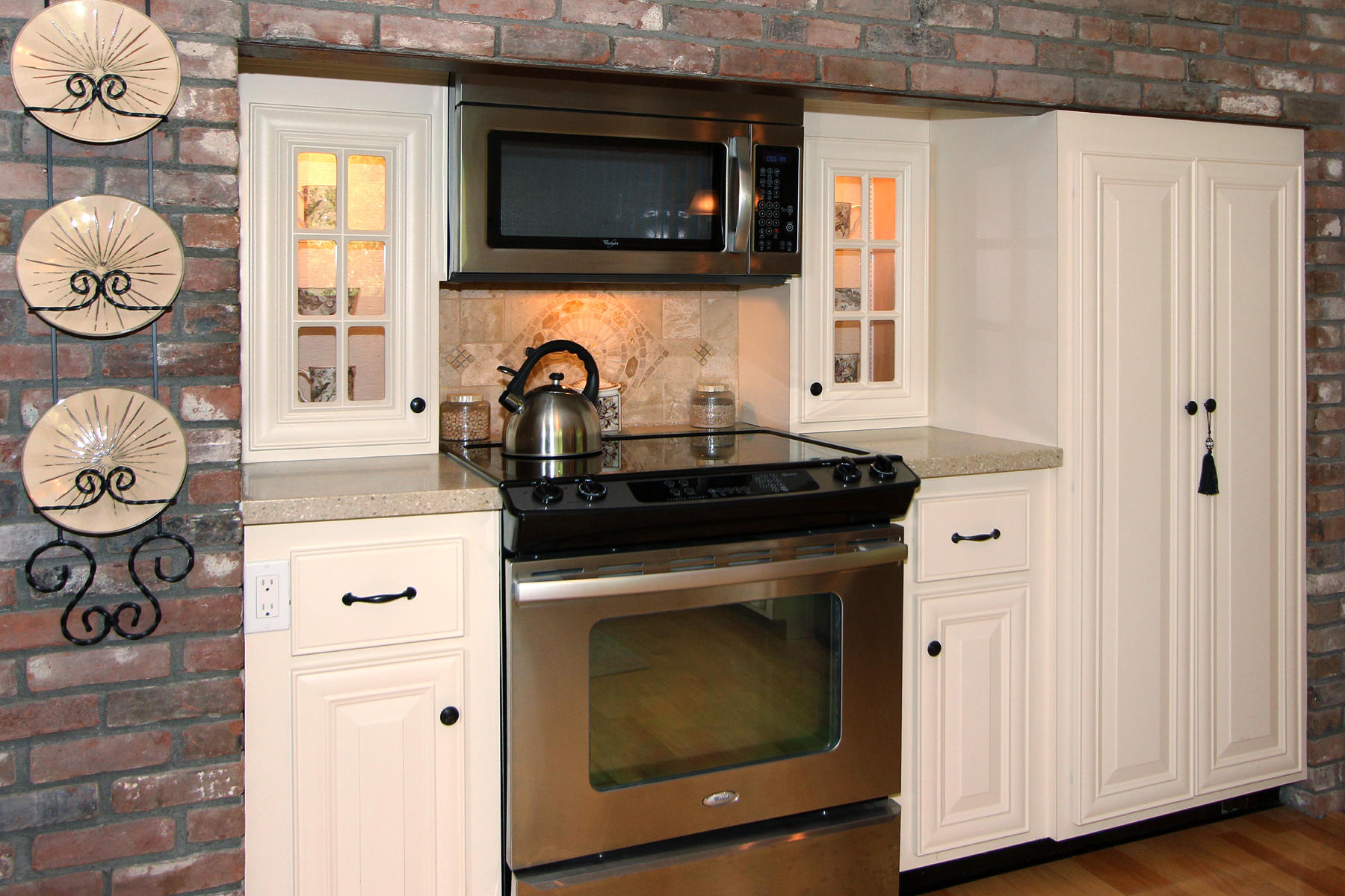 243 Midpine Road Cummaquid, MA 02675 - Photo 12 of 32 a kitchen with a stove and a microwave