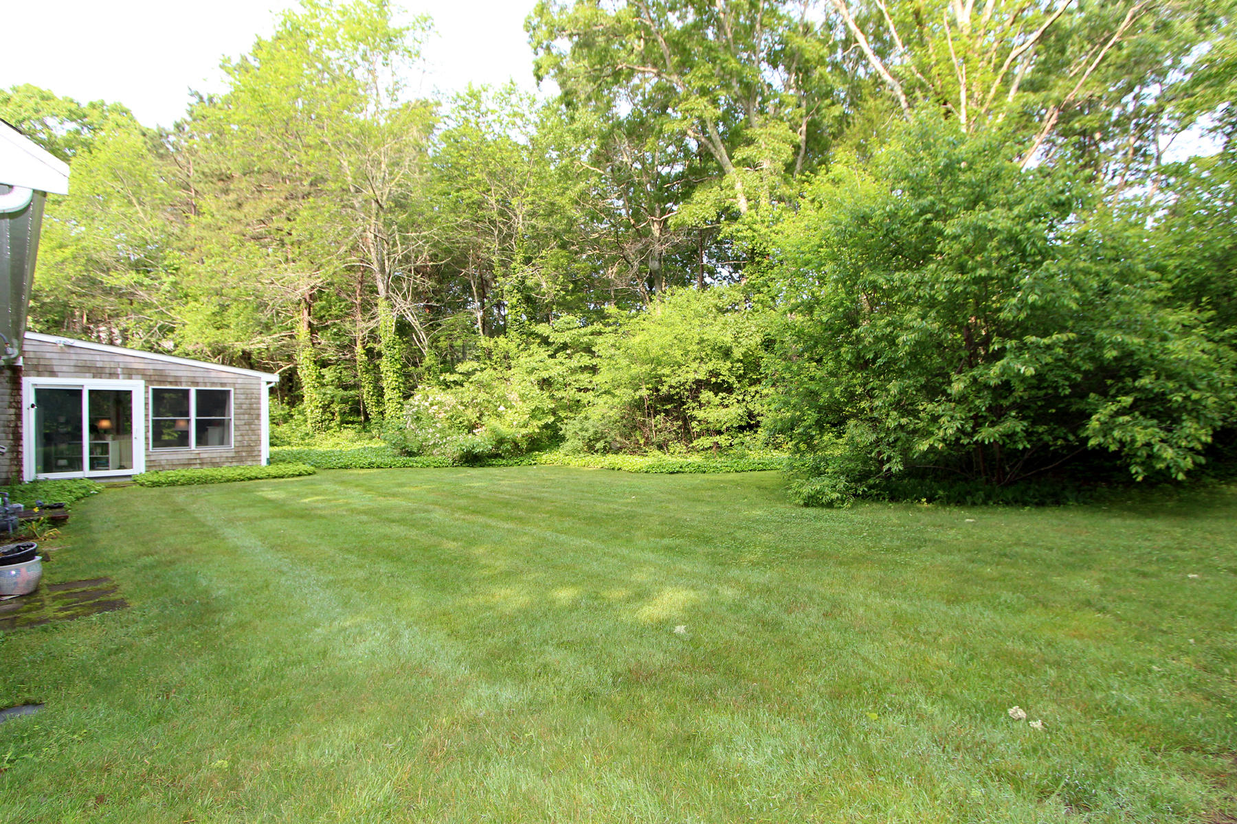 243 Midpine Road Cummaquid, MA 02675 - Photo 4 of 32 a view of a house with a backyard