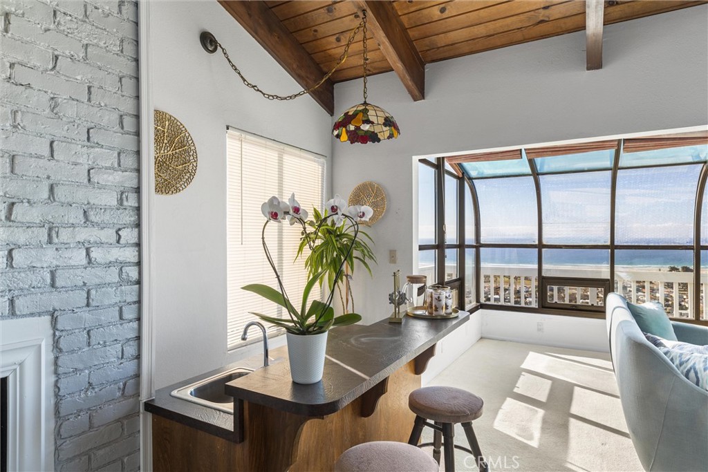 2631 Nutmeg Avenue Morro Bay, CA 93442 - Photo 12 of 39 a dining room with furniture and a potted plant