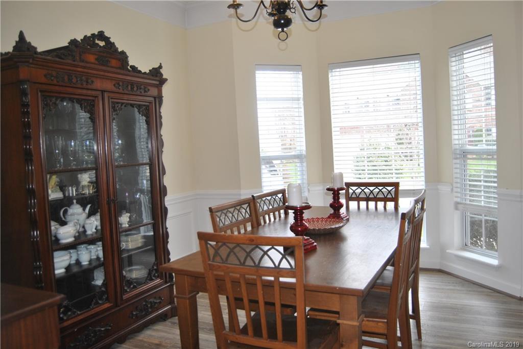 516 North Portman Lane, Unit 50 Fort Mill, SC 29708 - Photo 8 of 18 a view of a dining room with furniture window and wooden floor