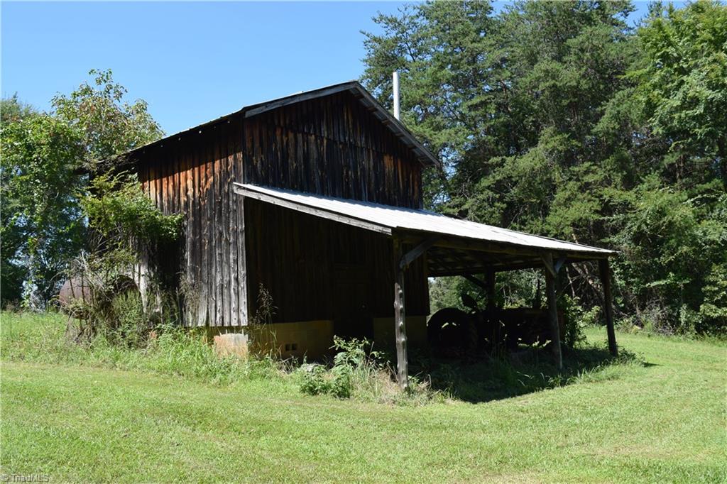 1030 Ellisboro Road Madison, NC 27025 - Photo 15 of 30 1 of several tobacco barns. This barn features lien-to on 2 sides. Unbelievable wood beams and boards.