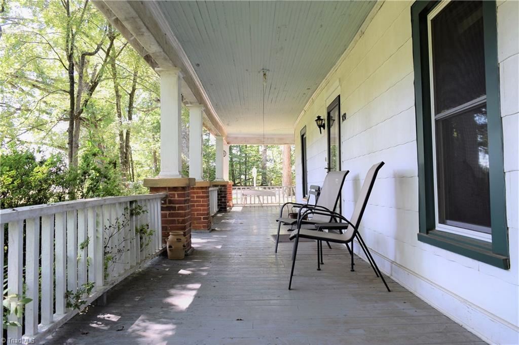 1030 Ellisboro Road Madison, NC 27025 - Photo 20 of 30 Enjoy Southern Charm at its Best! Wrap around porch that is 8 ft wide.