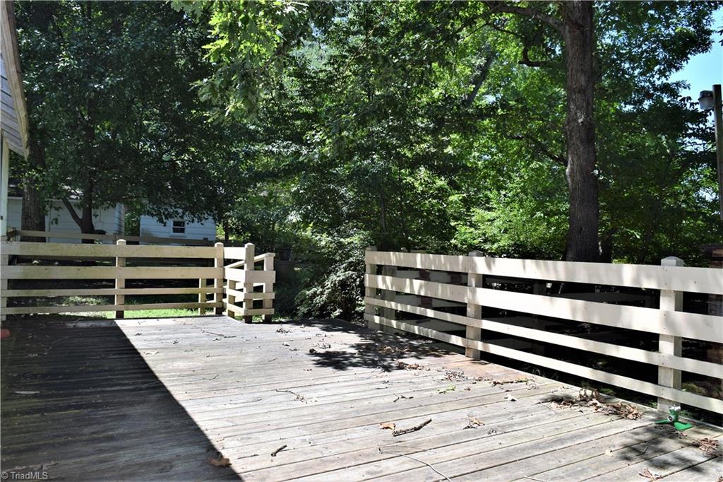 1030 Ellisboro Road Madison, NC 27025 - Photo 22 of 30 Well built deck overlooking wooded backyard. Also has a fenced-in area as you step off deck.