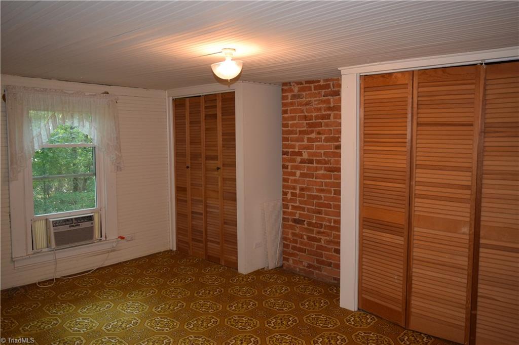 1030 Ellisboro Road Madison, NC 27025 - Photo 28 of 30 4 Bedroom: Has wood floors under carpet. 2 closets. Upstairs
