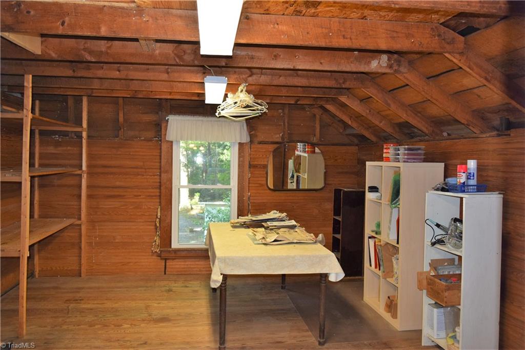 1030 Ellisboro Road Madison, NC 27025 - Photo 30 of 30 Unfinished Walk-in Attic. No heated/cooled but does have lights. Note the beautiful floors and beams.