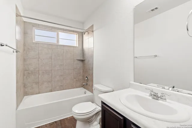 a bathroom with a sink a toilet and a bathtub