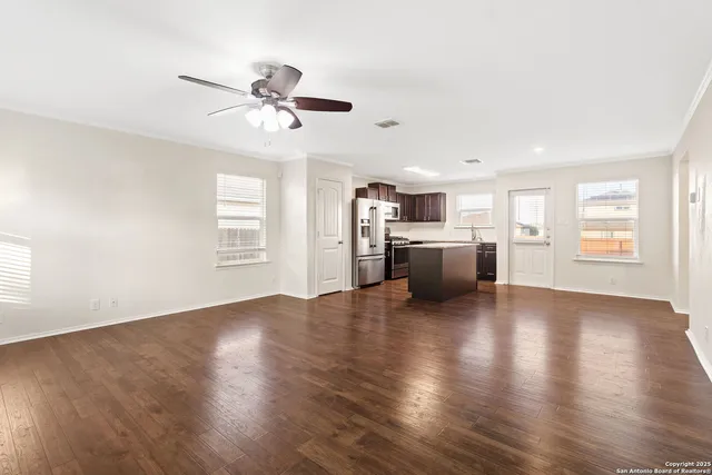 a view of a kitchen with a stove cabinets and wooden floor