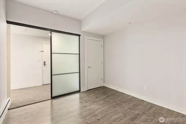 an empty room with wooden floor
