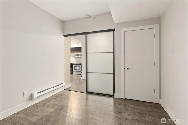 a view of a hallway with washer and dryer
