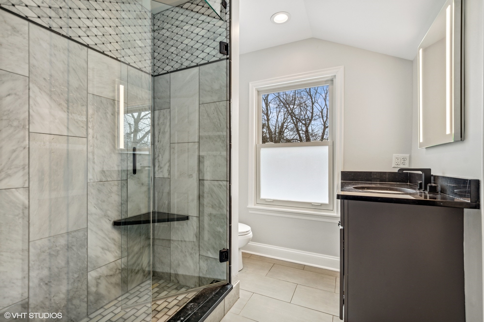 574 Braeside Road Highland Park, IL 60035 - Photo 17 of 29 a bathroom with a granite countertop sink a toilet and shower