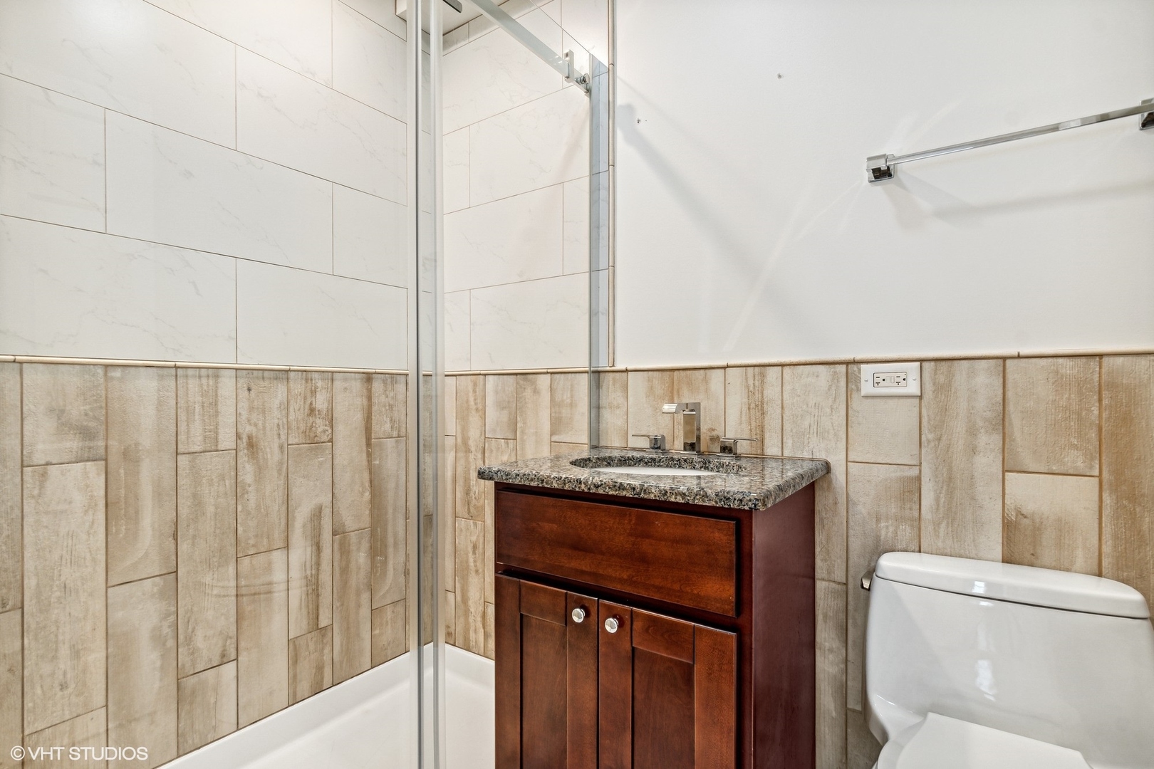 574 Braeside Road Highland Park, IL 60035 - Photo 21 of 29 a bathroom with a granite countertop sink a toilet and shower