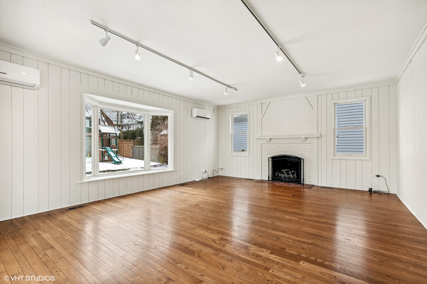574 Braeside Road Highland Park, IL 60035 - Photo 10 of 29 a view of empty room with wooden floor and fireplace
