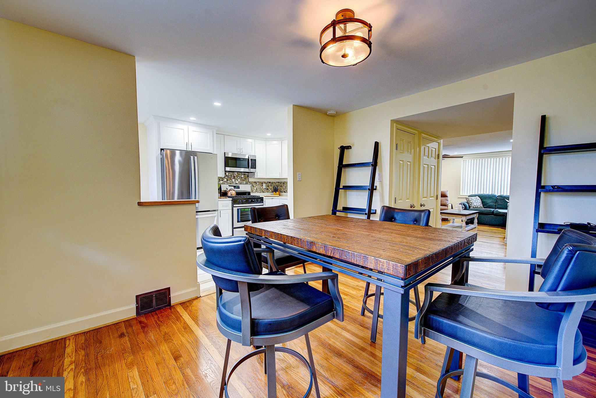 1367 Adair Road Brookhaven, PA 19015 - Photo 11 of 34 a dining room with furniture and wooden floor