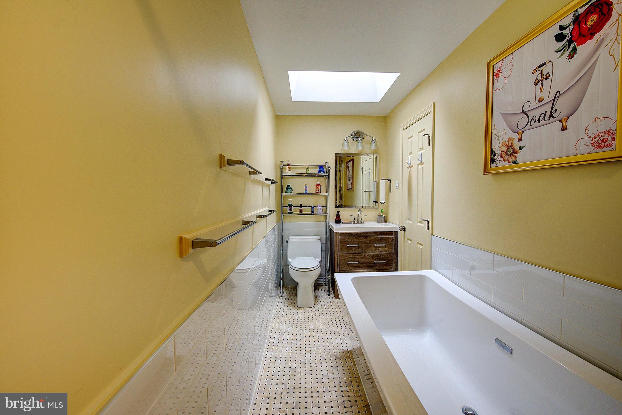 1367 Adair Road Brookhaven, PA 19015 - Photo 17 of 34 a bathroom with a sink a bathtub and toilet