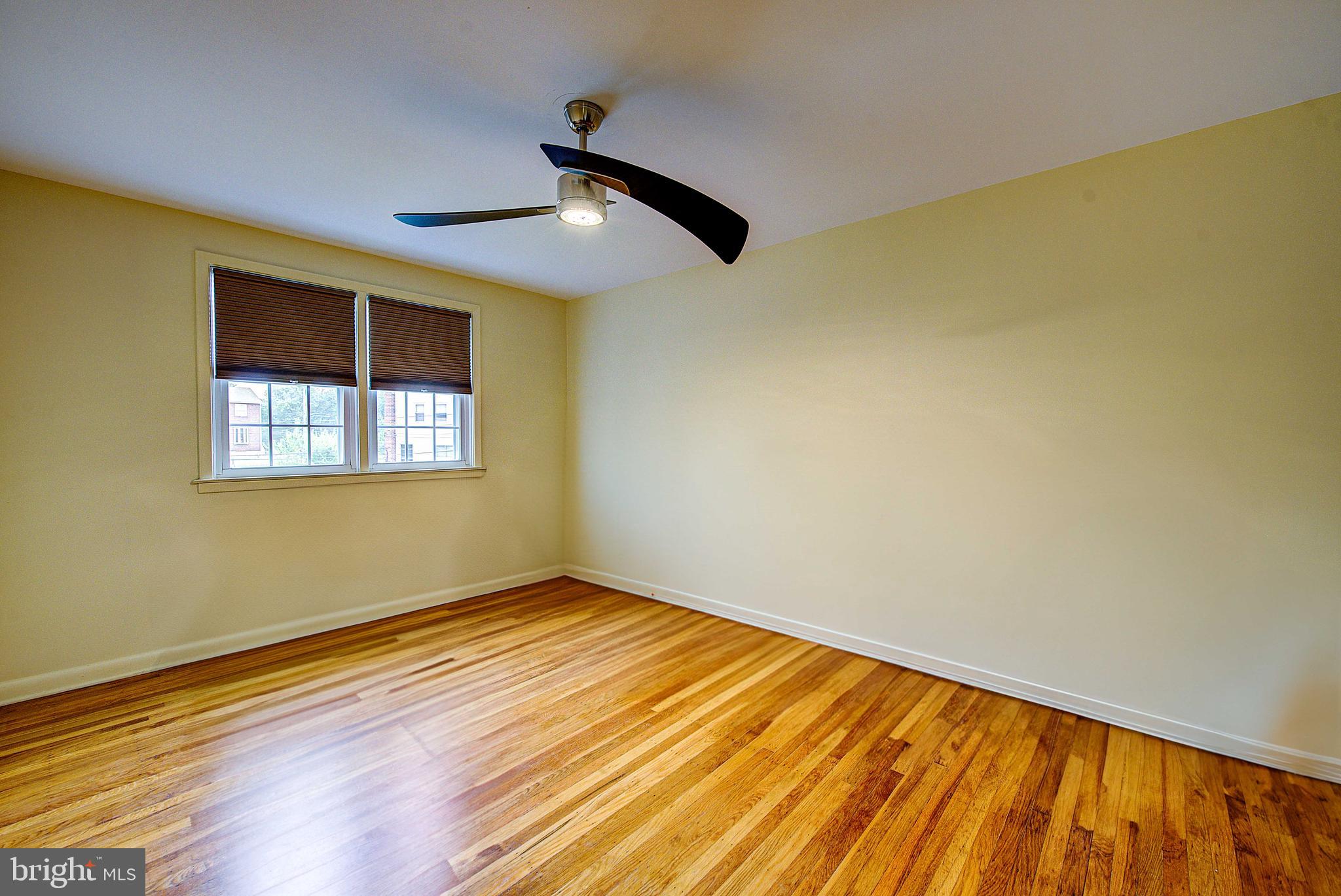 1367 Adair Road Brookhaven, PA 19015 - Photo 20 of 34 a view of empty room with wooden floor and fan