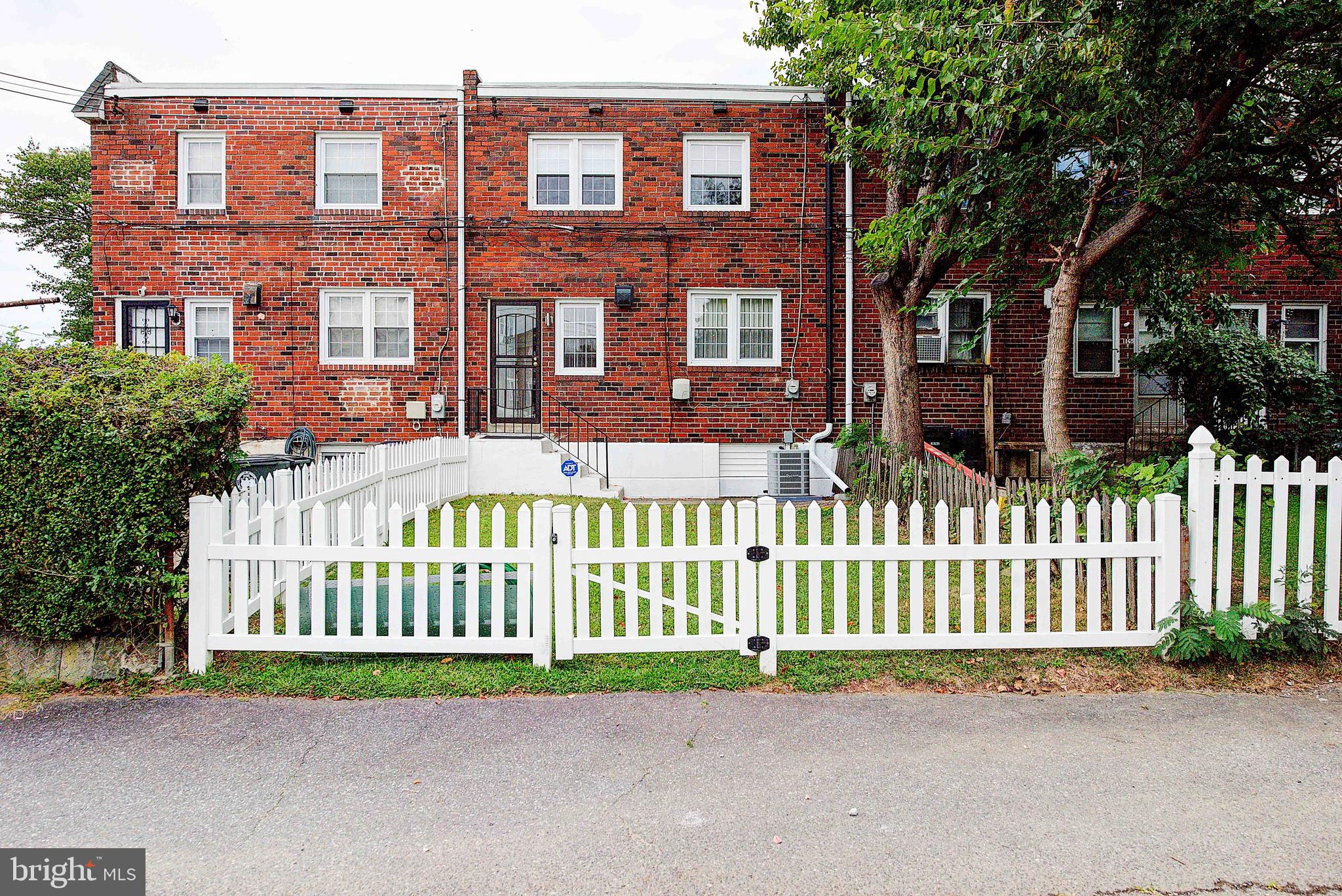 1367 Adair Road Brookhaven, PA 19015 - Photo 30 of 34 a front view of a house with a garden