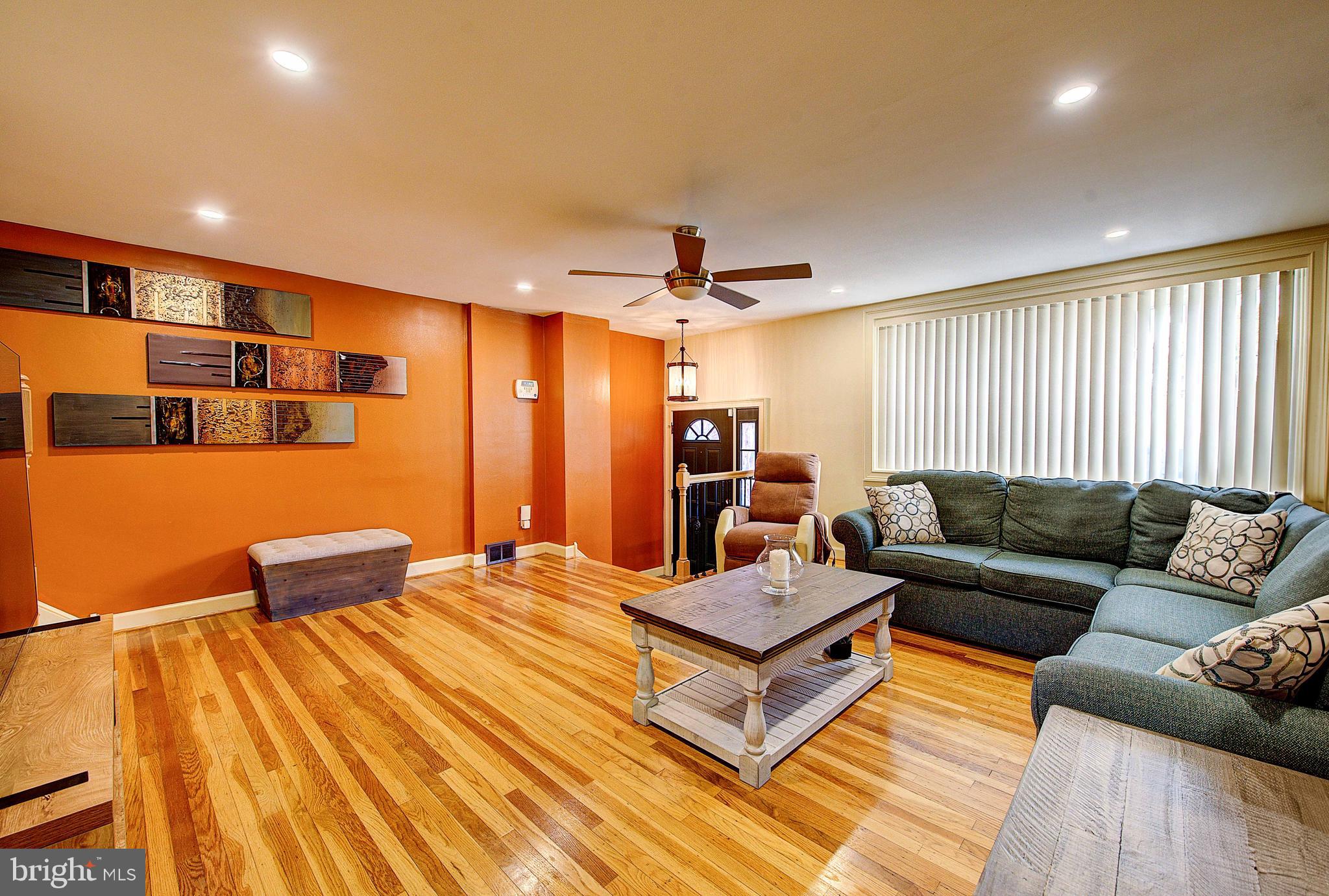 1367 Adair Road Brookhaven, PA 19015 - Photo 5 of 34 a living room with furniture and a wooden floor
