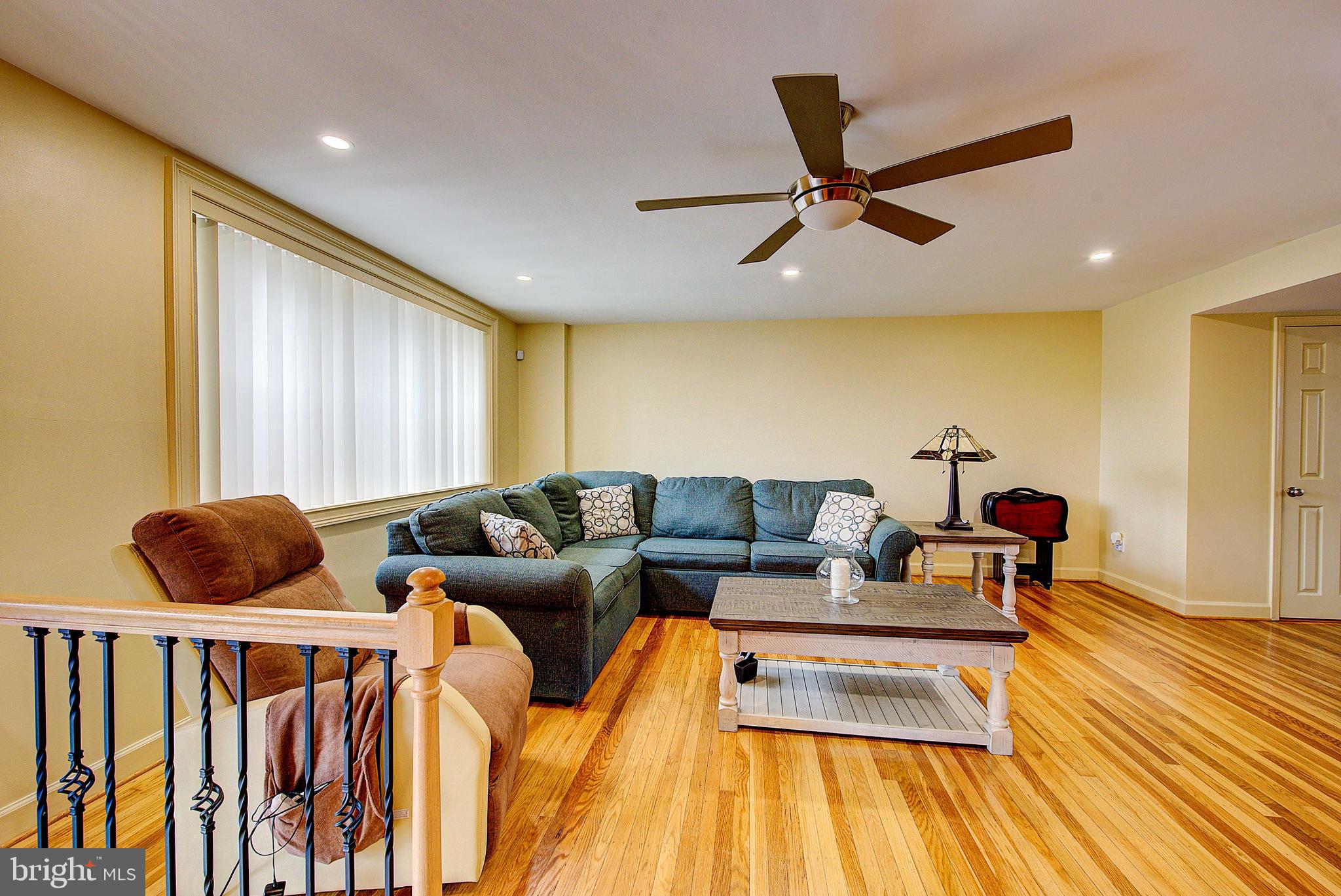 1367 Adair Road Brookhaven, PA 19015 - Photo 6 of 34 a living room with furniture and a wooden floor