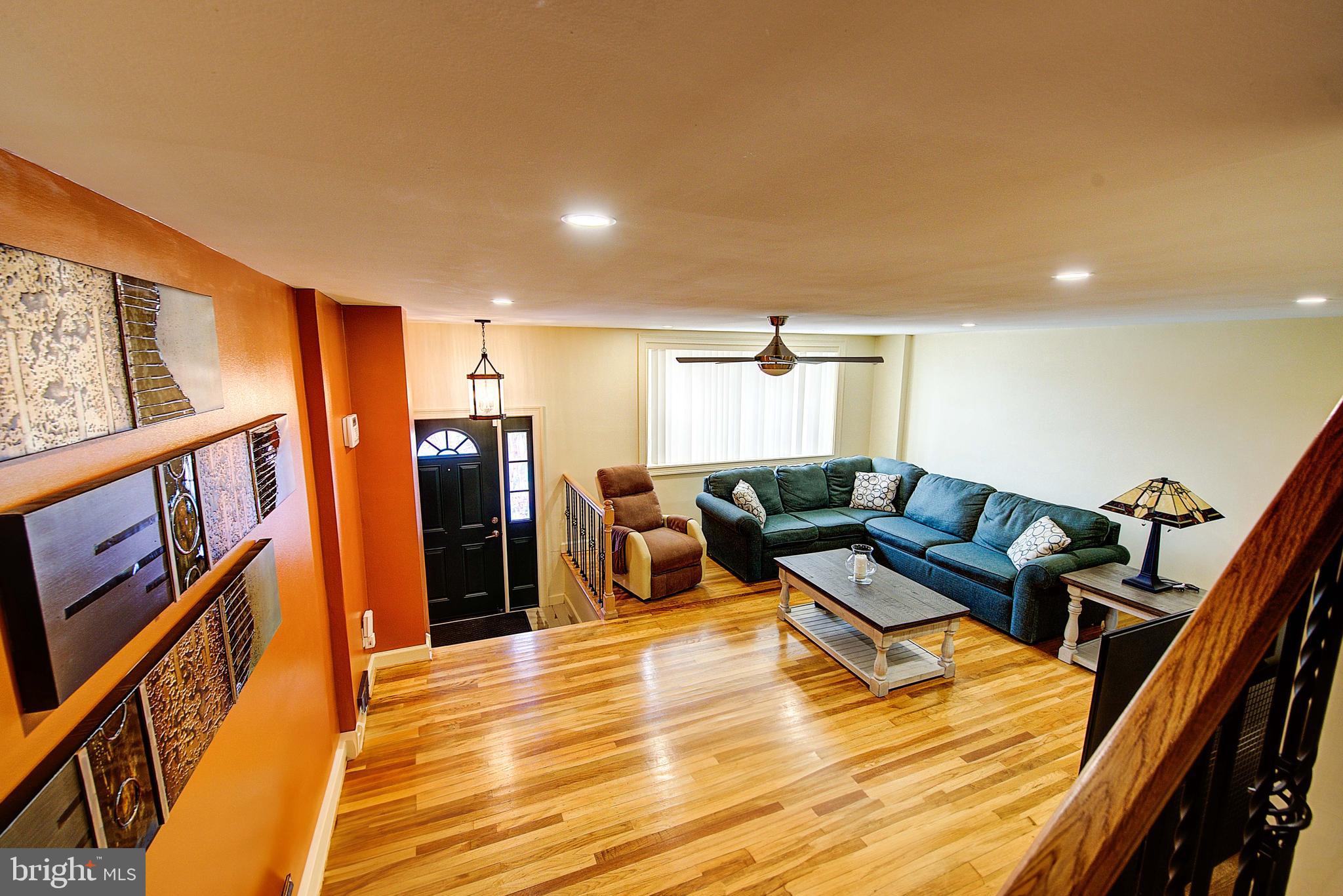 1367 Adair Road Brookhaven, PA 19015 - Photo 7 of 34 a living room with furniture and a flat screen tv