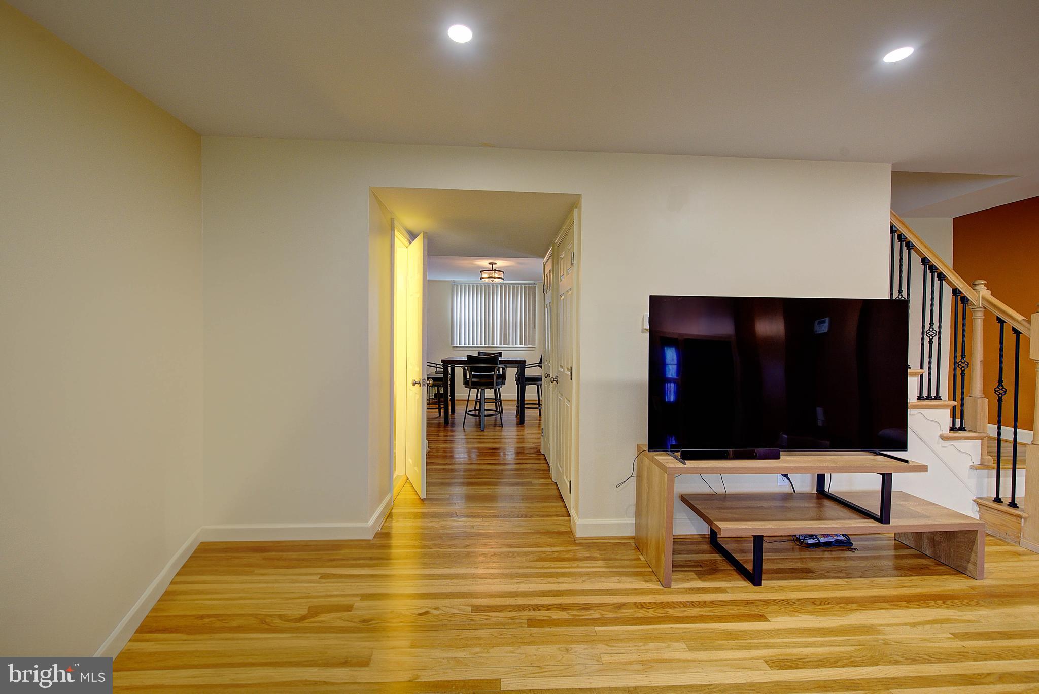 1367 Adair Road Brookhaven, PA 19015 - Photo 8 of 34 a living room with dining room and wooden floor