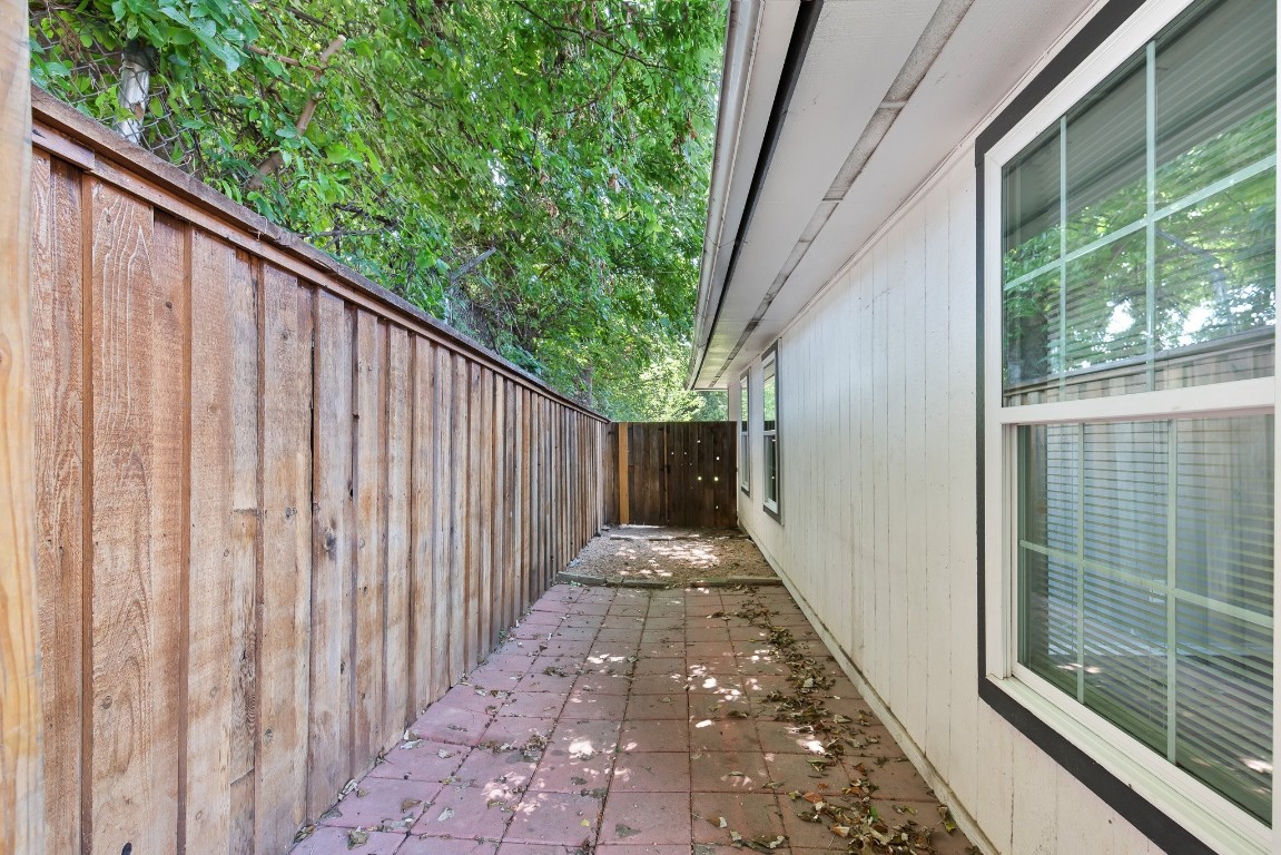 7617 Meador Avenue, Unit A Austin, TX 78752 - Photo 17 of 21 a view of a pathway with a balcony