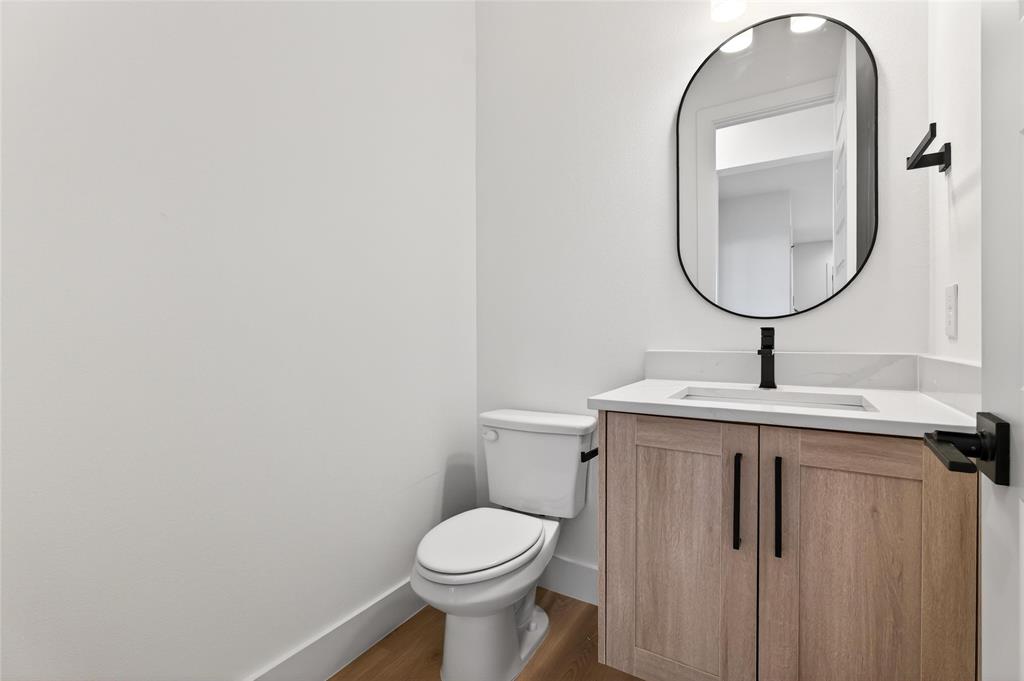 8901 Lowell Street Rowlett, TX 75089 - Photo 11 of 24 Bathroom with vanity and wood finished floors