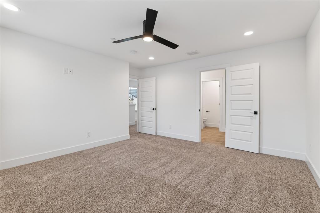 8901 Lowell Street Rowlett, TX 75089 - Photo 14 of 24 Unfurnished bedroom featuring recessed lighting, light colored carpet, ceiling fan, and connected bathroom