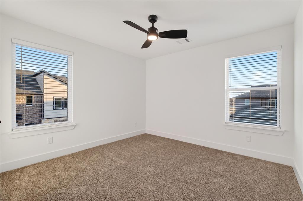 8901 Lowell Street Rowlett, TX 75089 - Photo 15 of 24 Unfurnished room featuring carpet and a ceiling fan
