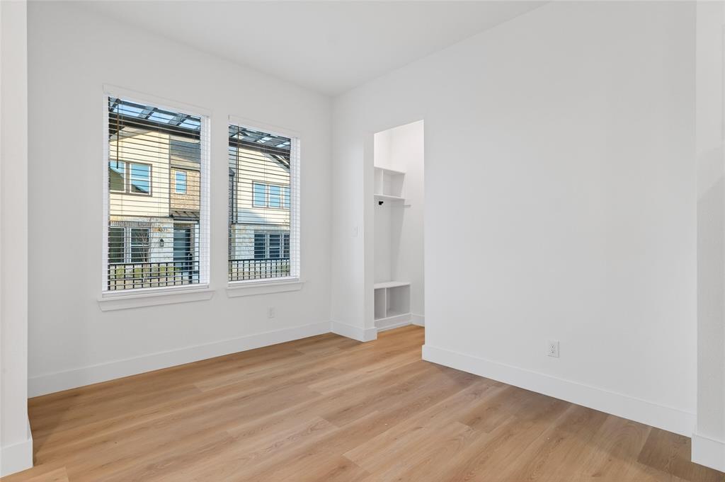 8901 Lowell Street Rowlett, TX 75089 - Photo 22 of 24 Empty room with baseboards and light wood finished floors