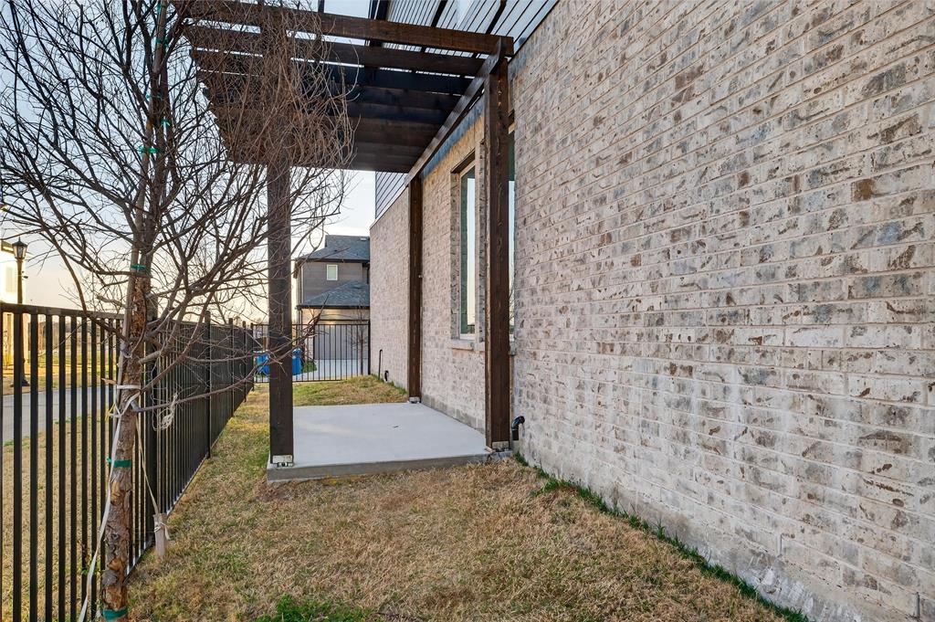 8901 Lowell Street Rowlett, TX 75089 - Photo 4 of 24 Fenced yard with a patio and a pergola