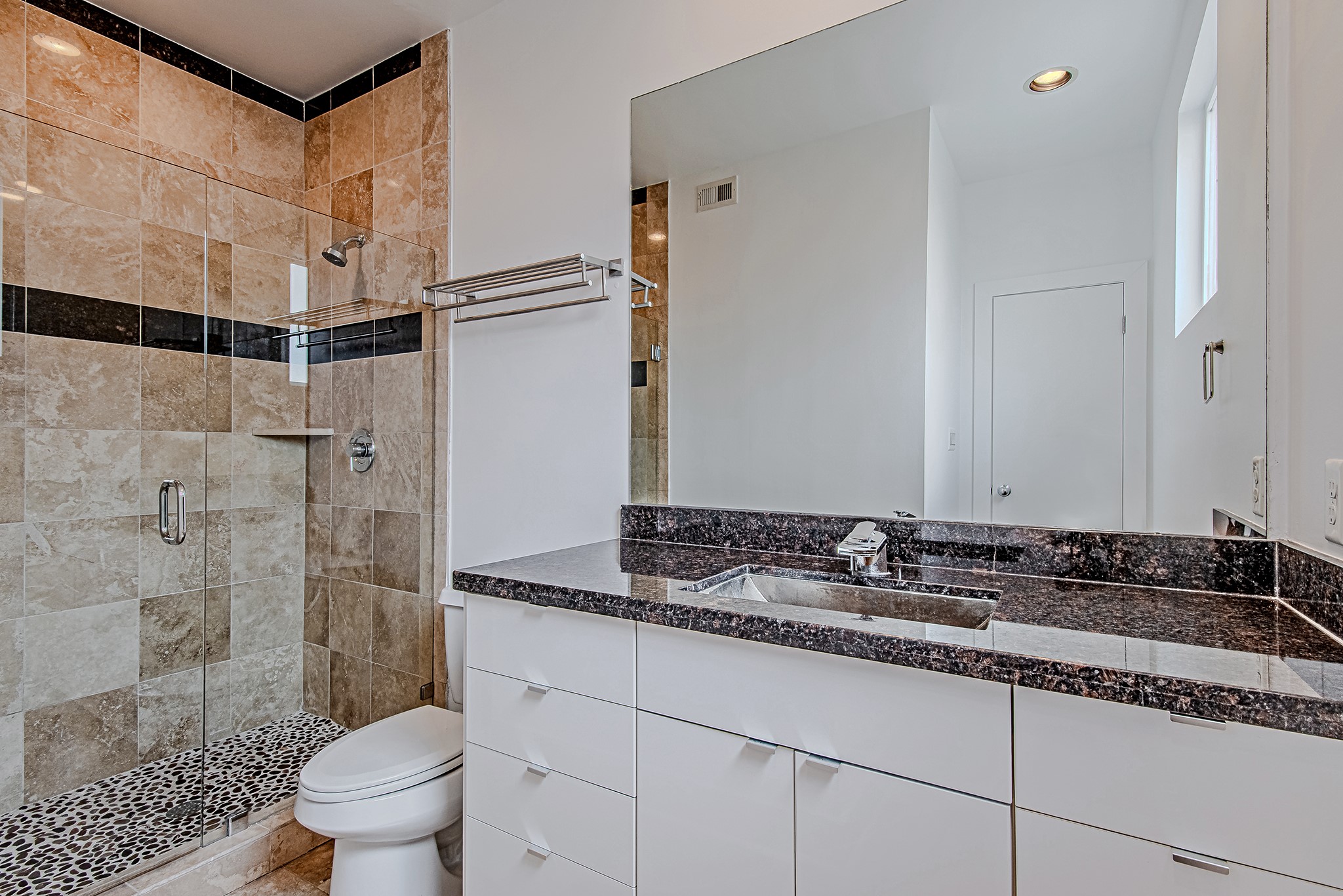 2025 Colquitt Street, Unit E Houston, TX 77098 - Photo 23 of 29 Secondary bathroom with clean finishes and a functional vanity layout.