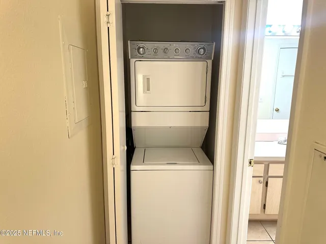 a view of a city from a glass door