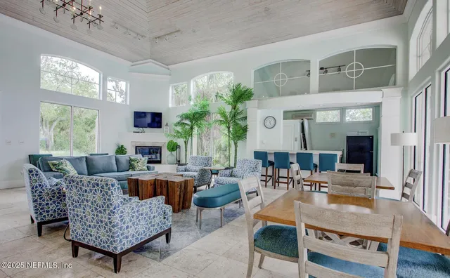 a view of swimming pool with outdoor seating and plants