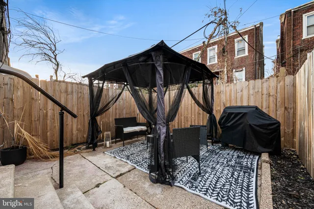 a view of a house with a door and wooden walls