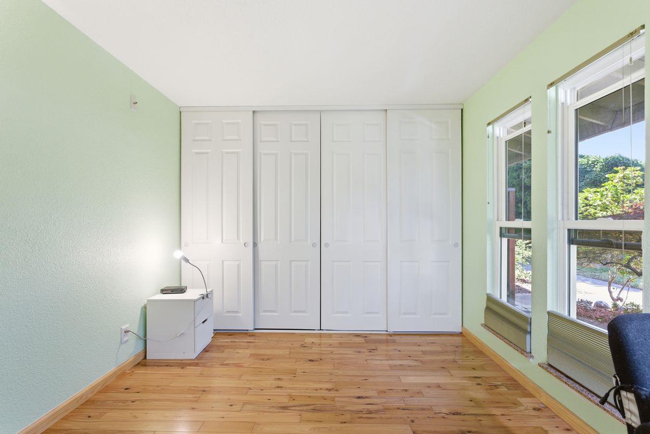 5561 Roundtree Common Fremont, CA 94538 - Photo 12 of 29 a view of a room with wooden floor and fan