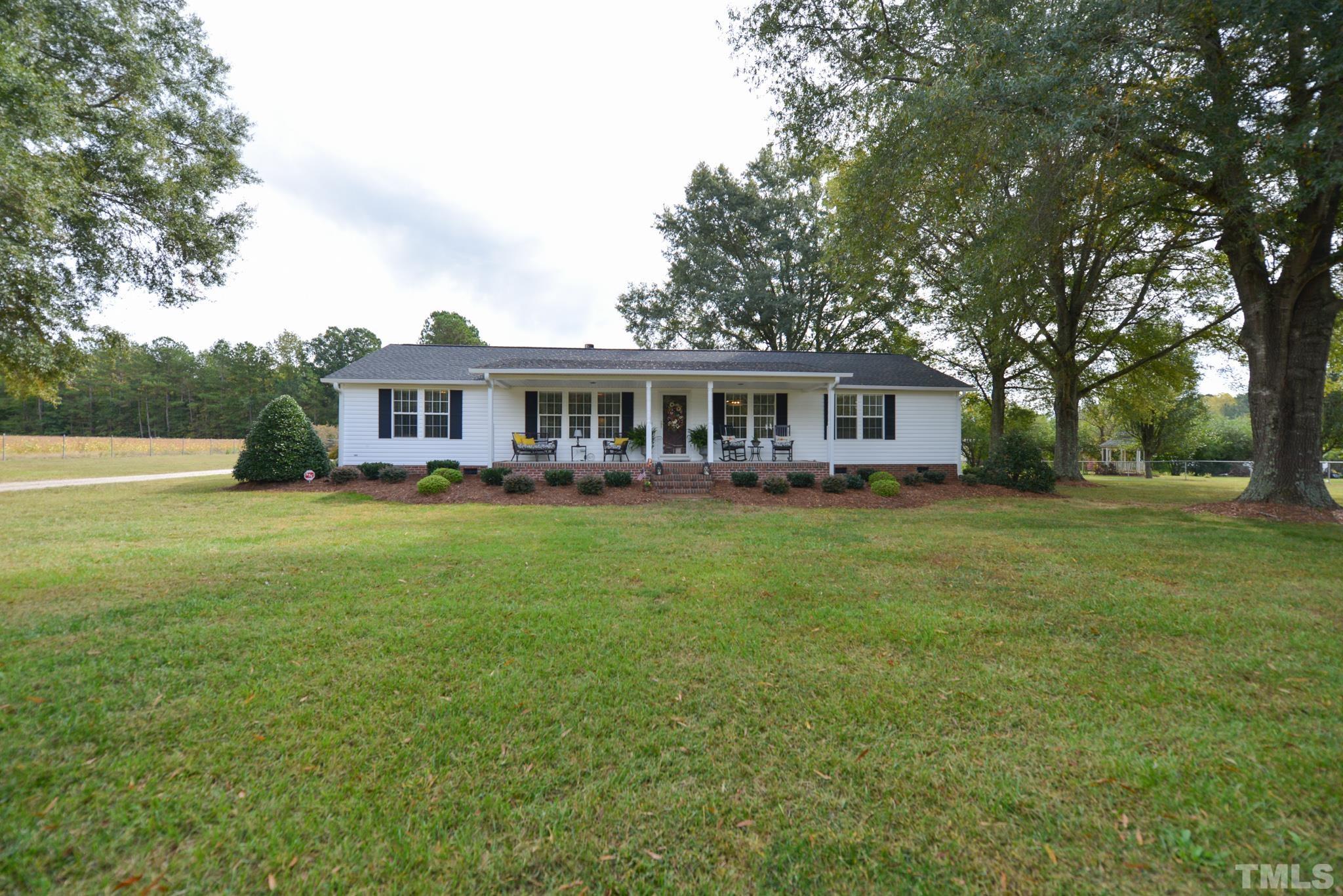 7175 Driver Road Zebulon, NC 27597 - Photo 2 of 30 a view of a house with a big yard