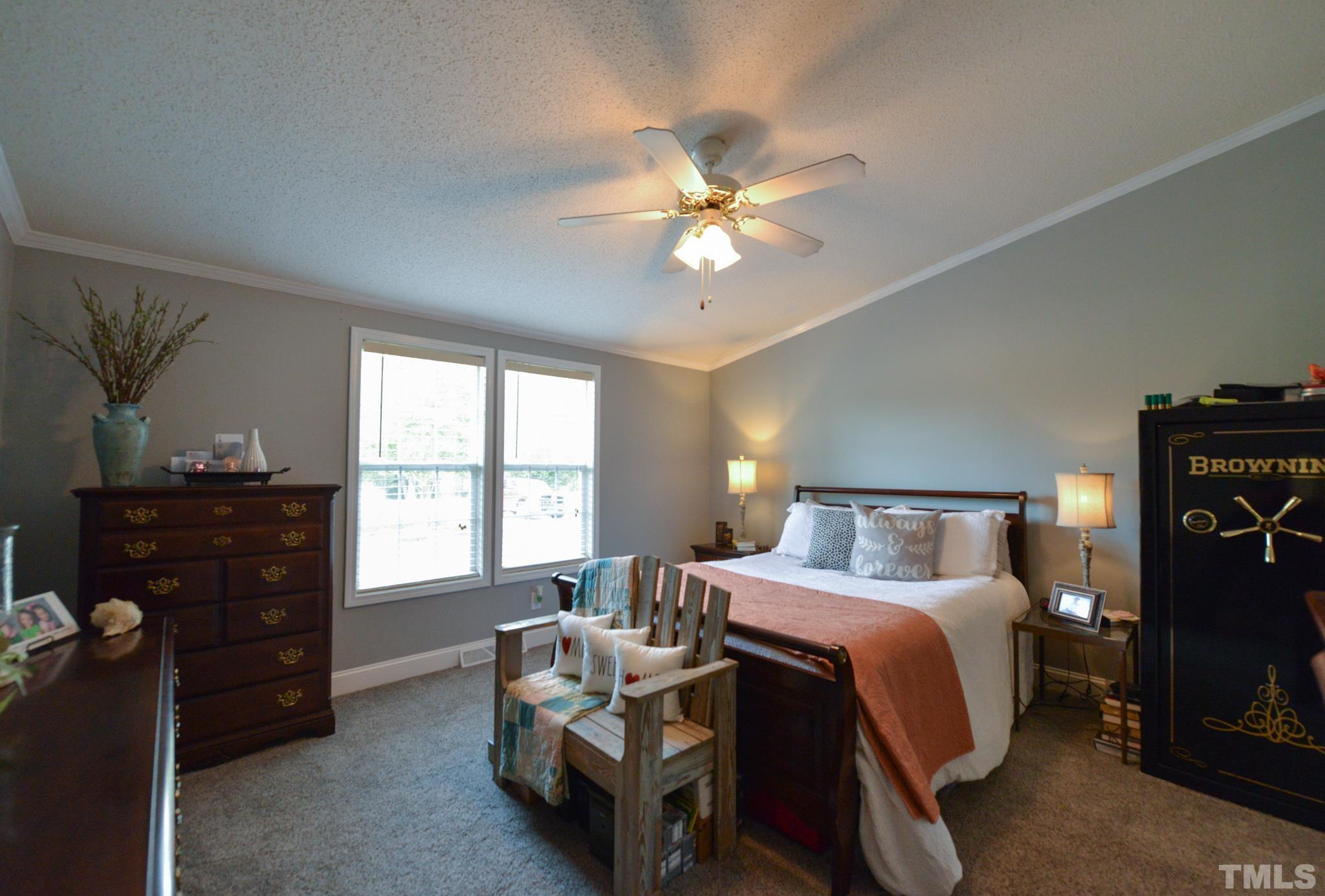 7175 Driver Road Zebulon, NC 27597 - Photo 12 of 30 a bedroom with a bed and a window