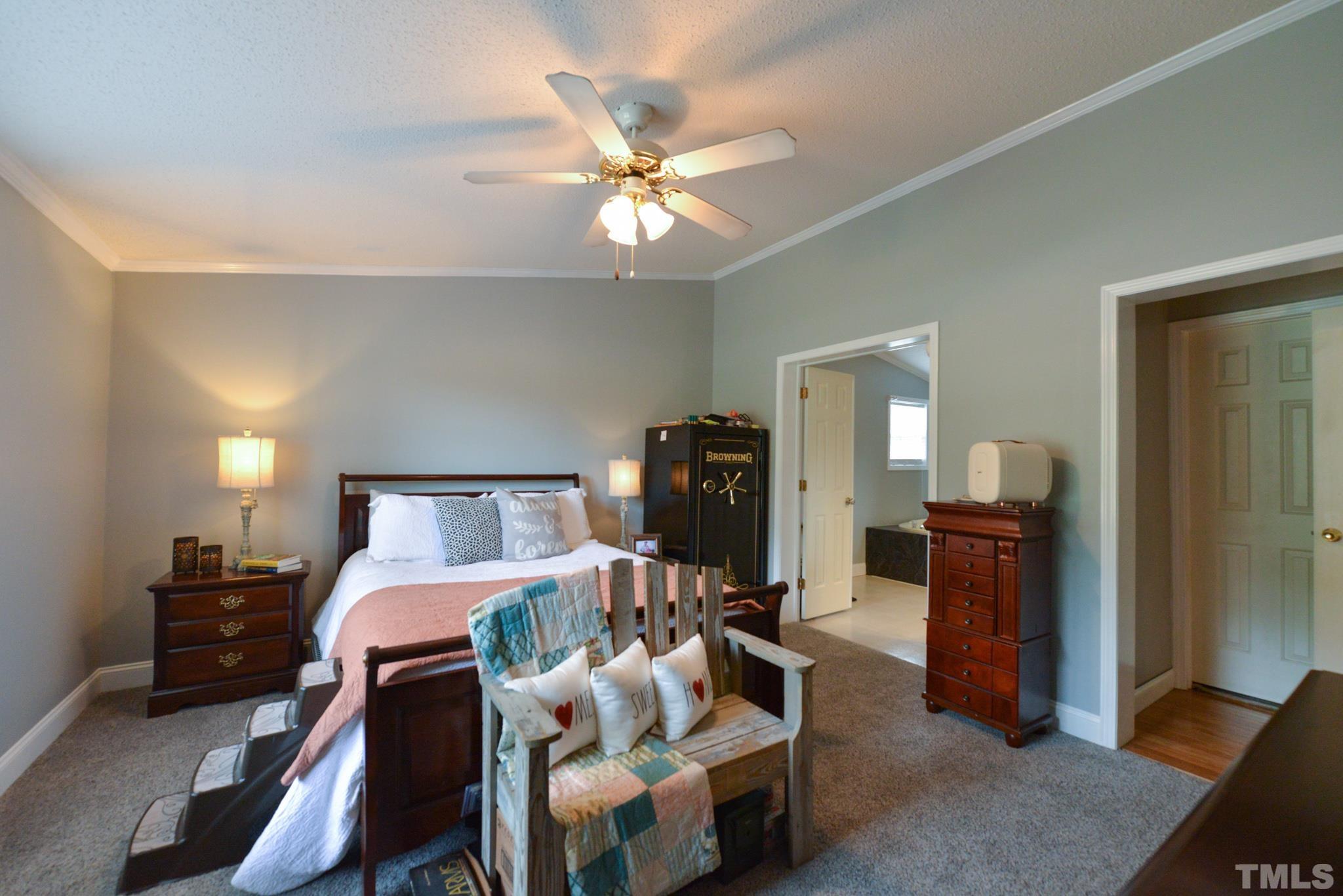 7175 Driver Road Zebulon, NC 27597 - Photo 13 of 30 a bed room with a bed and a television