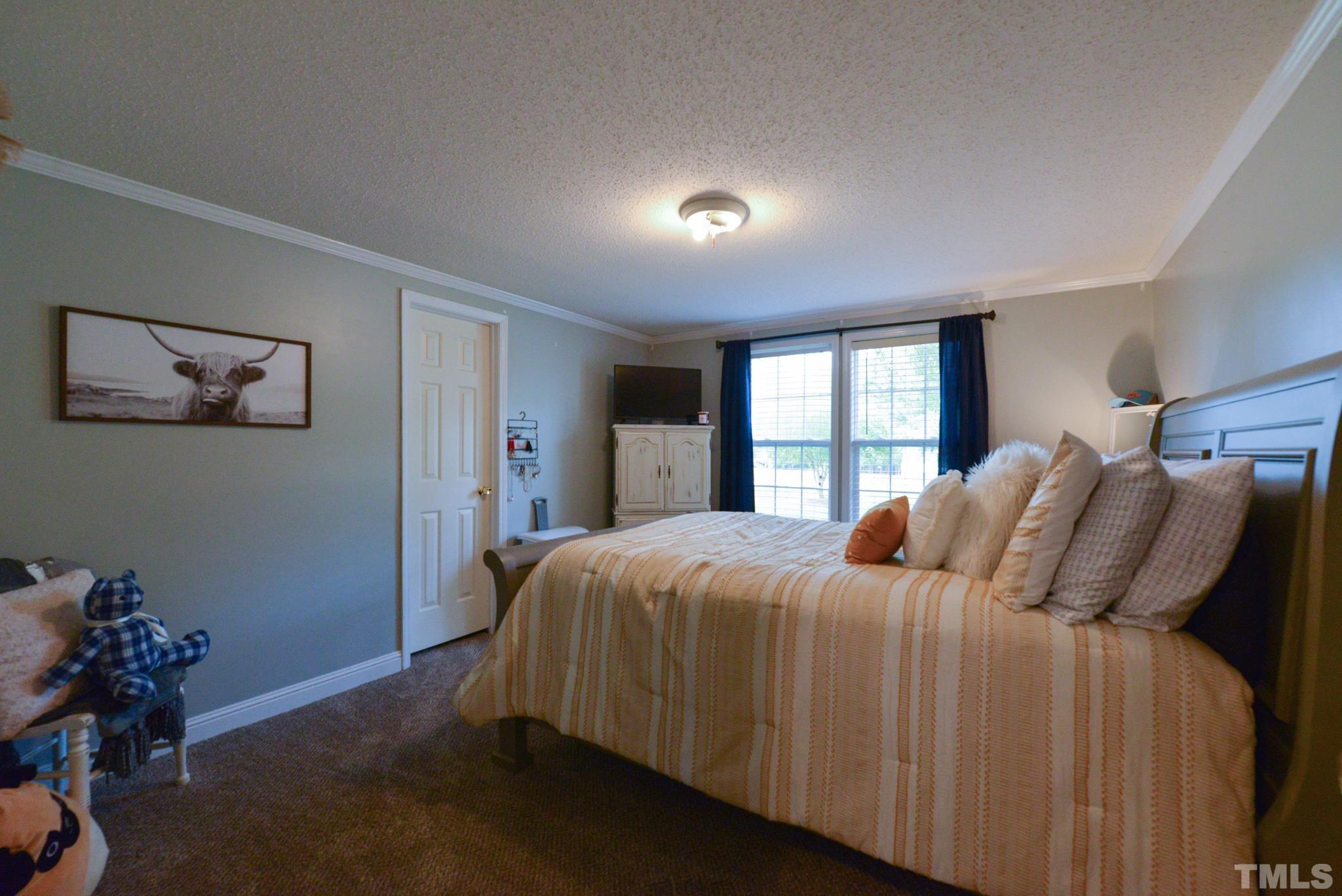 7175 Driver Road Zebulon, NC 27597 - Photo 20 of 30 a bedroom with a bed and a window