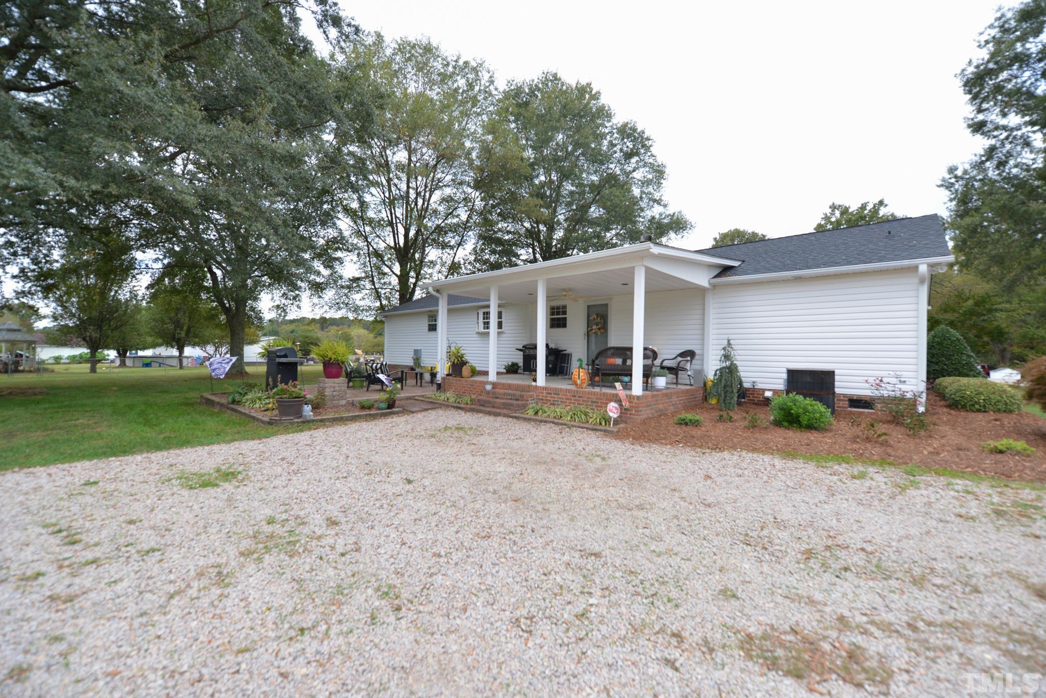 7175 Driver Road Zebulon, NC 27597 - Photo 26 of 30 a view of a yard with a patio