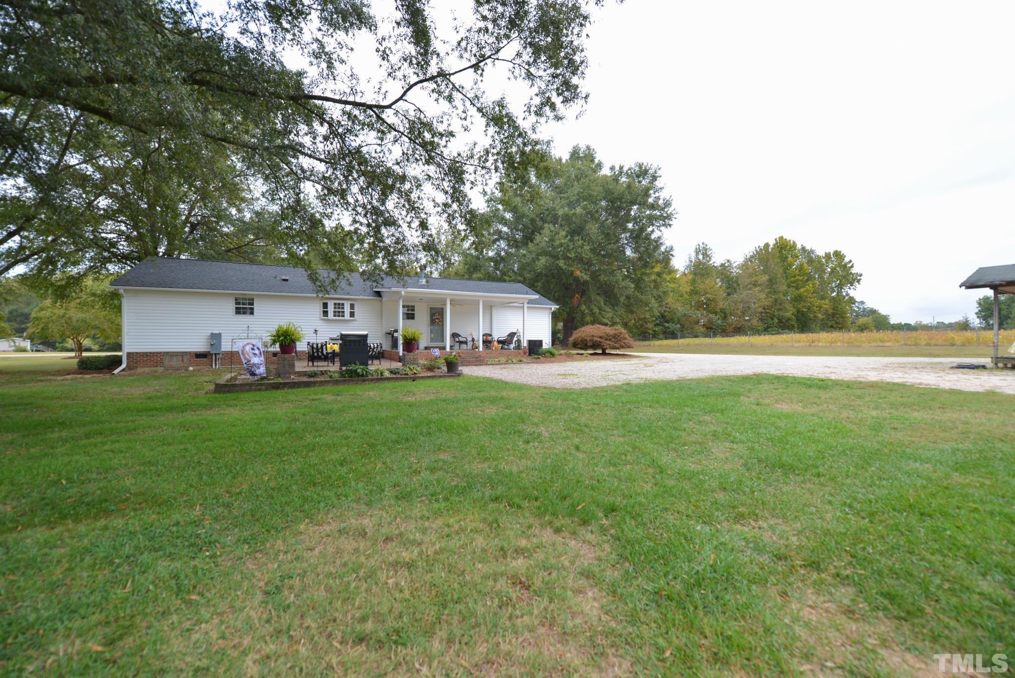 7175 Driver Road Zebulon, NC 27597 - Photo 27 of 30 a front view of house with yard and seating area