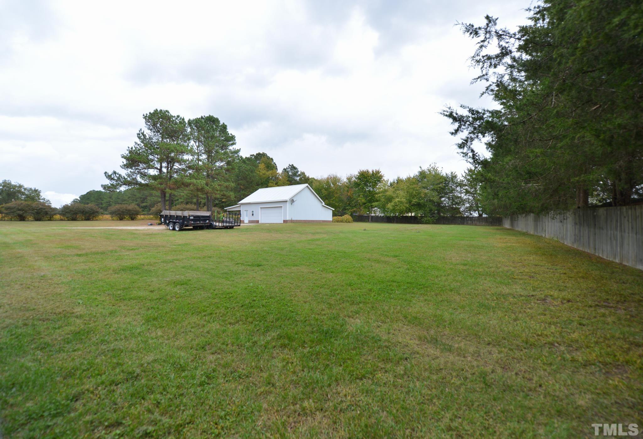7175 Driver Road Zebulon, NC 27597 - Photo 29 of 30 a view of a house with a yard