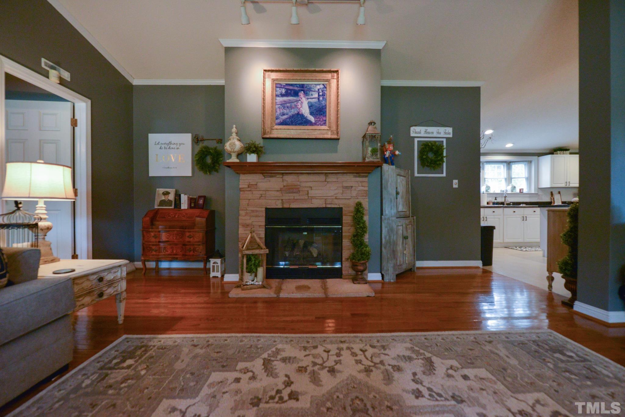 7175 Driver Road Zebulon, NC 27597 - Photo 4 of 30 a living room with furniture and a fireplace