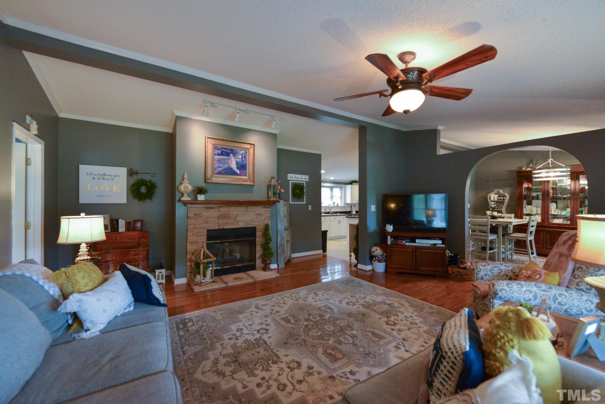 7175 Driver Road Zebulon, NC 27597 - Photo 5 of 30 a living room with furniture and a fireplace