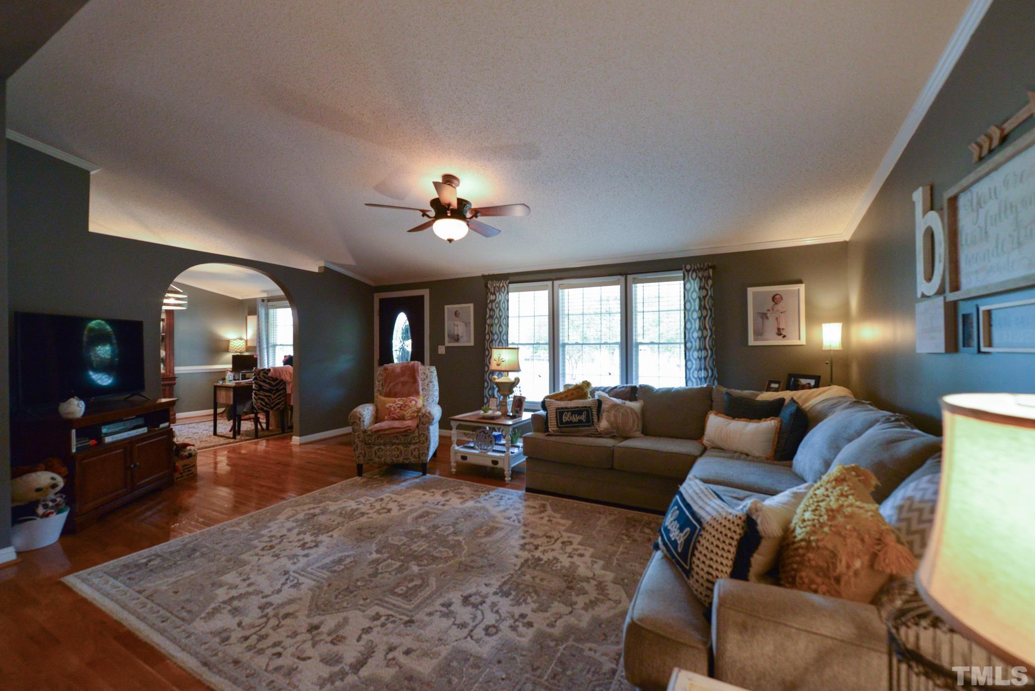 7175 Driver Road Zebulon, NC 27597 - Photo 6 of 30 a living room with furniture and wooden floor