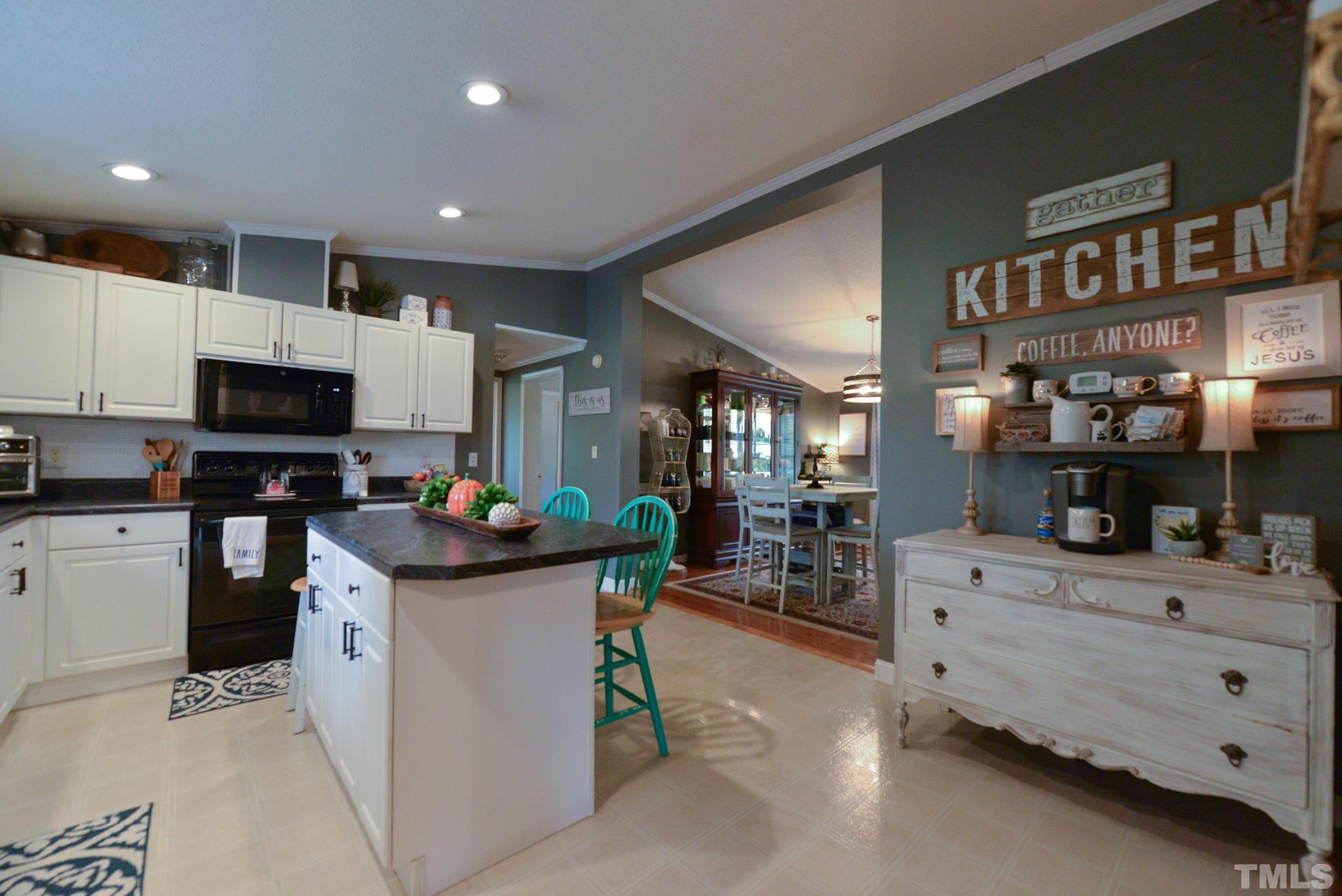 7175 Driver Road Zebulon, NC 27597 - Photo 10 of 30 a kitchen that has a lot of cabinets in it and appliances