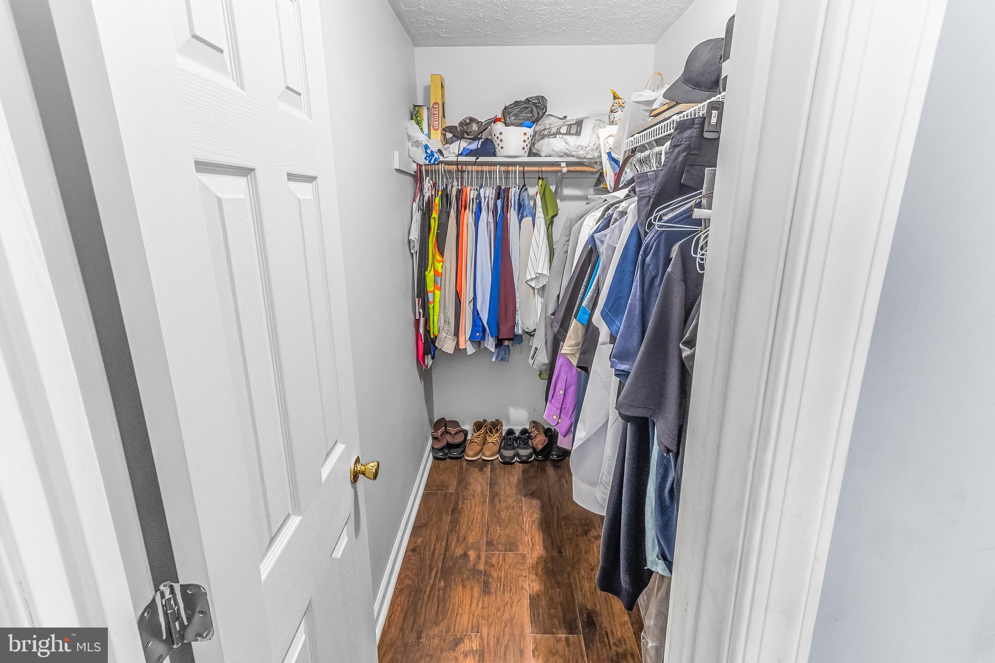 207 Preston Place Ranson, WV 25438 - Photo 13 of 32 a view of walk in closet with clothes and shoes